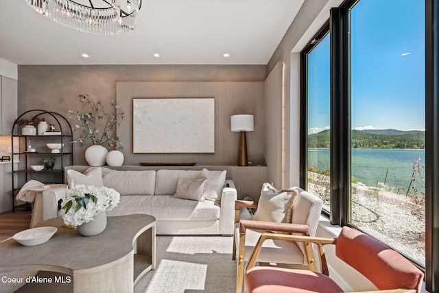 55 S Thistle Down Ln, Laclede, ID 83841 - living area featuring a water view, a chandelier, and recessed lighting