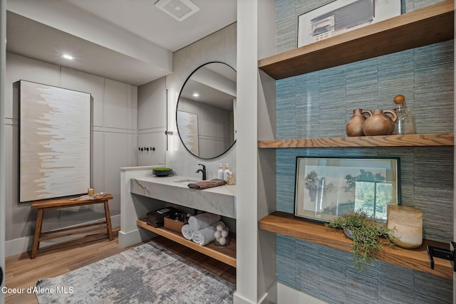 55 S Thistle Down Ln, Laclede, ID 83841 - bathroom with wood finished floors, baseboards, and a sink