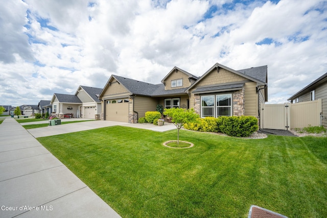 craftsman house featuring stone siding, a gate, concrete driveway, a garage, and a residential view