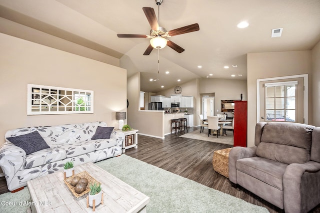 living room featuring recessed lighting, a ceiling fan, dark wood finished floors, baseboards, and vaulted ceiling