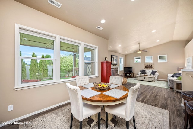 dining space with baseboards, plenty of natural light, recessed lighting, and vaulted ceiling