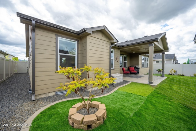rear view of house with a patio