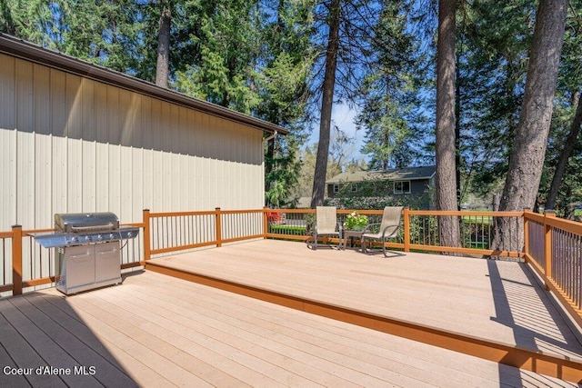 wooden deck featuring area for grilling