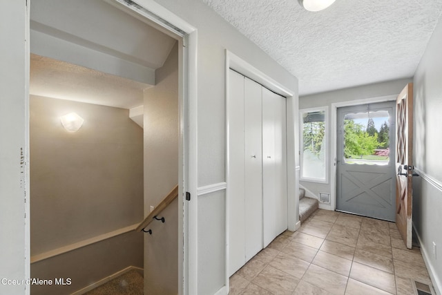 6699 Colburn Culver Rd, Sandpoint, ID 83864 - entryway with a textured ceiling and stairway