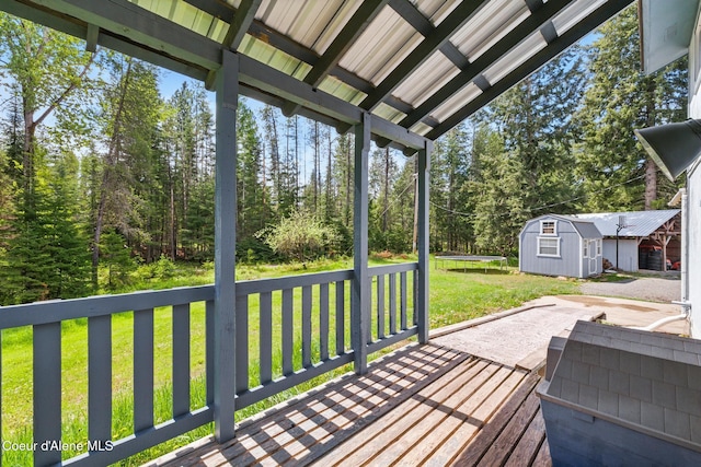 6699 Colburn Culver Rd, Sandpoint, ID 83864 - wooden deck featuring a trampoline, a yard, and a patio