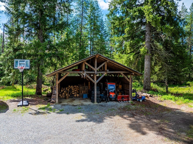 6699 Colburn Culver Rd, Sandpoint, ID 83864 - view of parking with a pole building and a carport