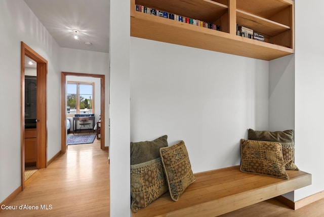 mudroom with light wood-style floors and baseboards