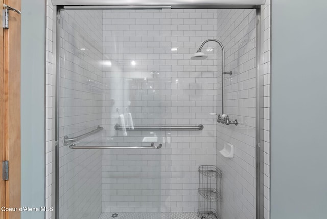 bathroom featuring a shower stall