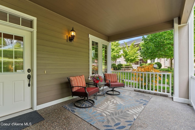 4461 W Greenchain Loop # 5, Coeur Dalene, ID 83814 - view of patio / terrace featuring a porch