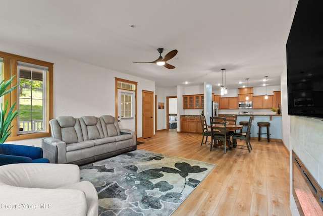 4461 W Greenchain Loop # 5, Coeur Dalene, ID 83814 - living room with light wood-style floors, a ceiling fan, recessed lighting, and baseboards