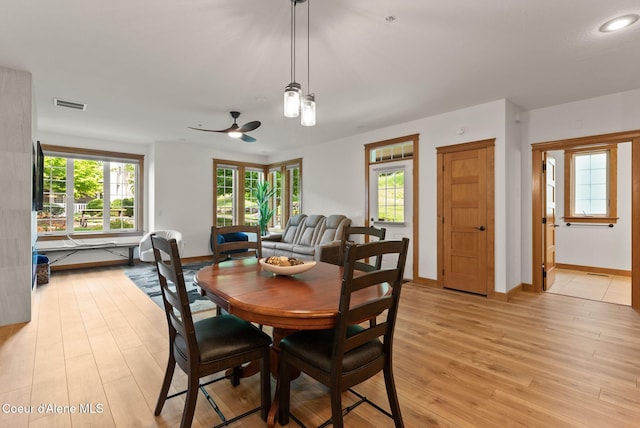 4461 W Greenchain Loop # 5, Coeur Dalene, ID 83814 - dining space featuring a ceiling fan, light wood-type flooring, and baseboards