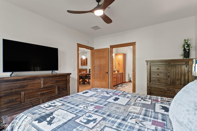 4461 W Greenchain Loop # 5, Coeur Dalene, ID 83814 - bedroom featuring ensuite bathroom and ceiling fan