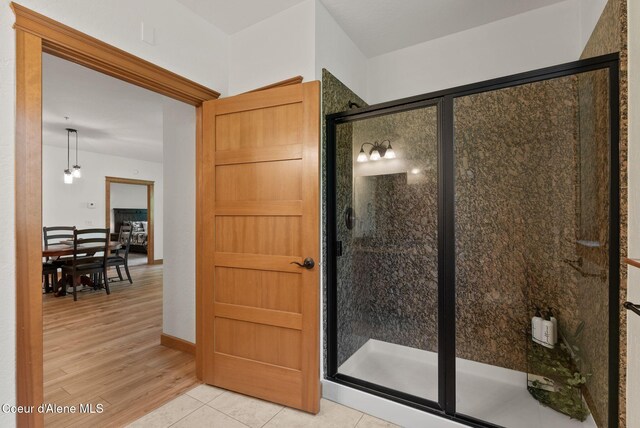 4461 W Greenchain Loop # 5, Coeur Dalene, ID 83814 - full bath featuring a stall shower and wood finished floors