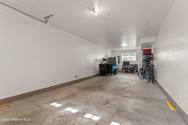 4461 W Greenchain Loop # 5, Coeur Dalene, ID 83814 - garage featuring baseboards