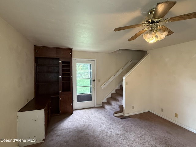 812 Silver St, Wallace, ID 83873 - entrance foyer featuring carpet, stairway, a ceiling fan, and baseboards