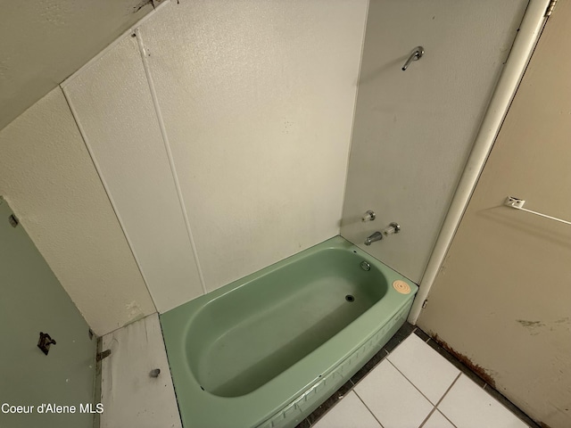 812 Silver St, Wallace, ID 83873 - full bath featuring a tub and tile patterned flooring