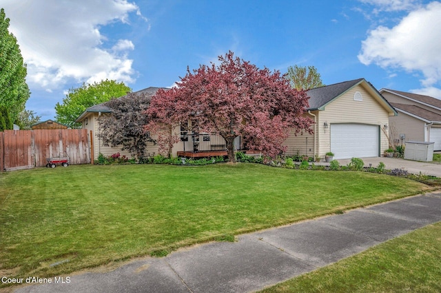 obstructed view of property featuring driveway and an attached garage