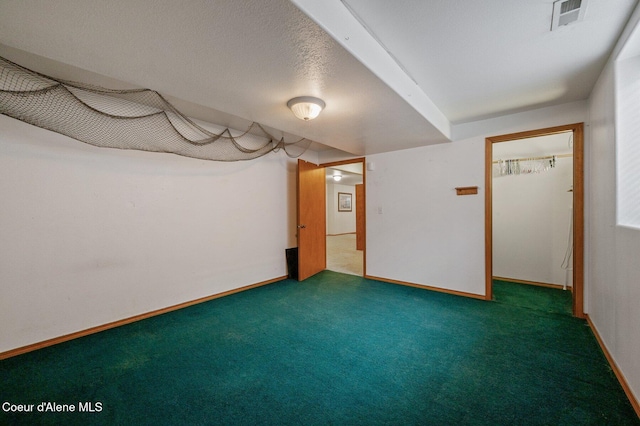finished below grade area featuring carpet floors and baseboards