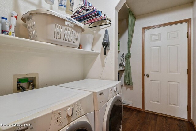 washroom featuring washer and dryer and dark wood finished floors
