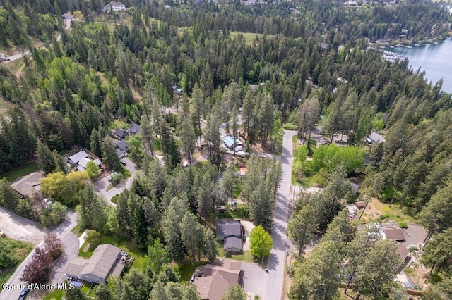 8694 N Clarkview Pl, Hayden Lake, ID 83835 - aerial view of property and surrounding area featuring a heavily wooded area, a large body of water, and nearby suburban area