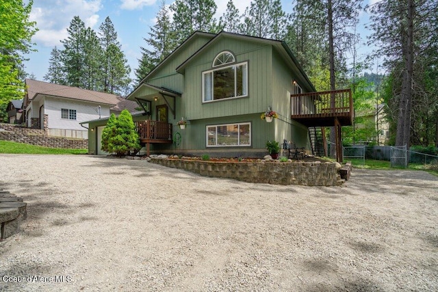 8694 N Clarkview Pl, Hayden Lake, ID 83835 - view of front of property with driveway, a deck, fence, and stairway