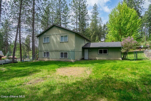 8694 N Clarkview Pl, Hayden Lake, ID 83835 - rear view of property featuring view of wooded area