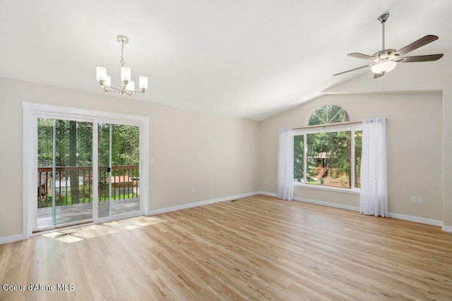 8694 N Clarkview Pl, Hayden Lake, ID 83835 - empty room featuring a chandelier, healthy amount of natural light, light wood-style flooring, vaulted ceiling, and baseboards