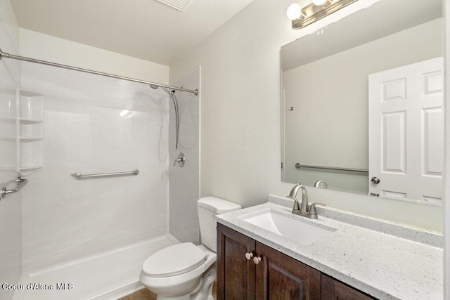 8694 N Clarkview Pl, Hayden Lake, ID 83835 - bathroom with toilet, vanity, and a shower