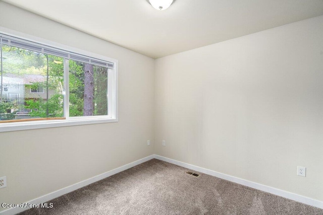 8694 N Clarkview Pl, Hayden Lake, ID 83835 - carpeted spare room featuring baseboards