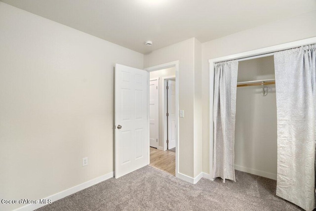 8694 N Clarkview Pl, Hayden Lake, ID 83835 - unfurnished bedroom featuring carpet floors, baseboards, and a closet