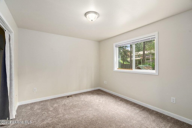 8694 N Clarkview Pl, Hayden Lake, ID 83835 - spare room with carpet floors and baseboards