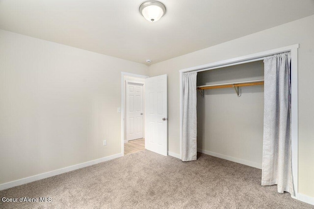 8694 N Clarkview Pl, Hayden Lake, ID 83835 - unfurnished bedroom featuring carpet, baseboards, and a closet