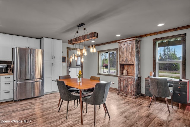 dining room featuring light wood-style floors, recessed lighting, baseboards, and a chandelier