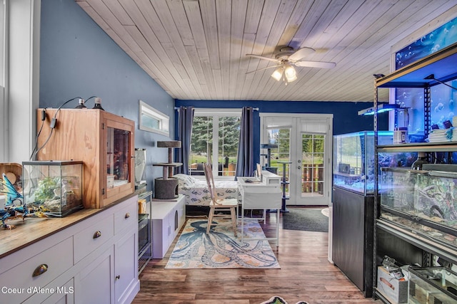 office space featuring ceiling fan, wood ceiling, and wood finished floors