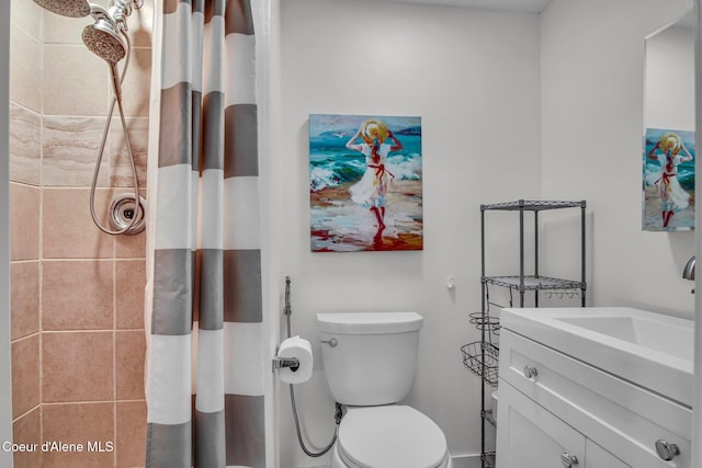 full bathroom with tiled shower, toilet, and vanity
