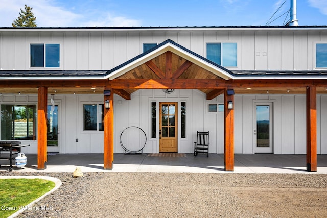 3298 W Coon Creek Rd, Plummer, ID 83851 - back of house featuring board and batten siding and a patio