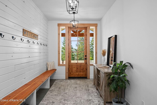 3298 W Coon Creek Rd, Plummer, ID 83851 - mudroom with baseboards and a chandelier