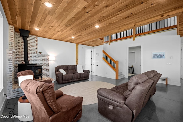 3298 W Coon Creek Rd, Plummer, ID 83851 - living area featuring recessed lighting, wooden ceiling, stairs, a wood stove, and baseboards
