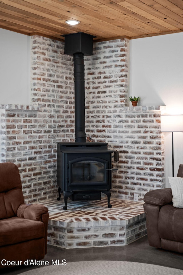 3298 W Coon Creek Rd, Plummer, ID 83851 - detailed view of wooden ceiling, a wood stove, and carpet