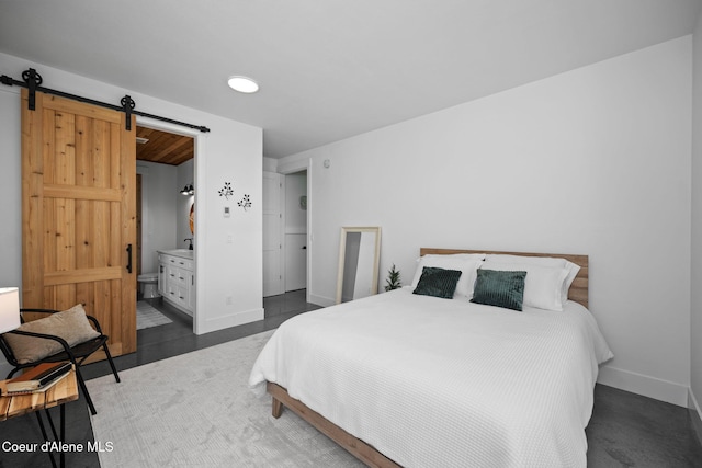 3298 W Coon Creek Rd, Plummer, ID 83851 - bedroom featuring a barn door, baseboards, and recessed lighting