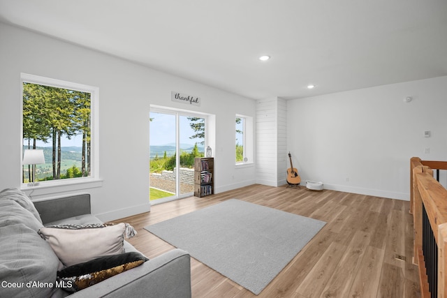 3298 W Coon Creek Rd, Plummer, ID 83851 - living area featuring healthy amount of natural light, baseboards, light wood finished floors, and recessed lighting