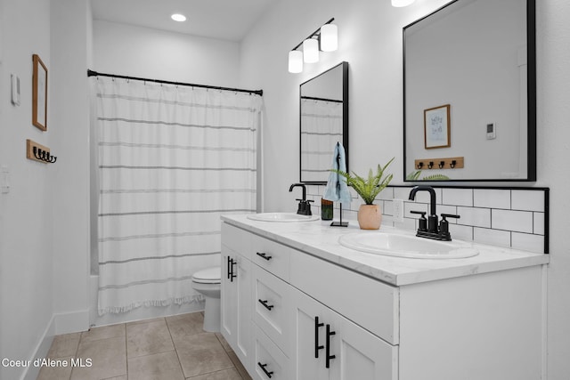 3298 W Coon Creek Rd, Plummer, ID 83851 - full bath with toilet, double vanity, tile patterned flooring, and shower / bath combo