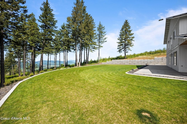 3298 W Coon Creek Rd, Plummer, ID 83851 - view of green lawn with a patio and a water view