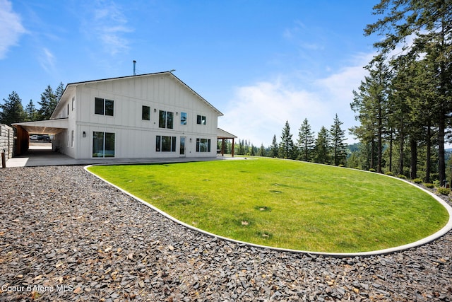 3298 W Coon Creek Rd, Plummer, ID 83851 - back of property with board and batten siding and a lawn