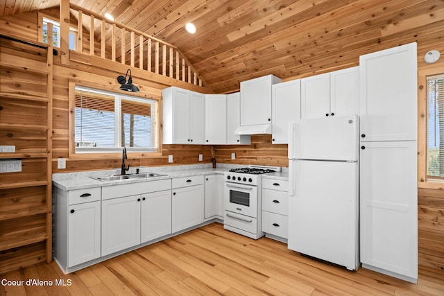 3298 W Coon Creek Rd, Plummer, ID 83851 - kitchen featuring white appliances, a sink, under cabinet range hood, lofted ceiling, and wood ceiling