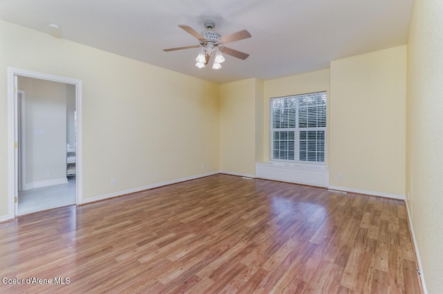 684 Chute Canyon Way, Bonners Ferry, ID 83805 - unfurnished room with light wood-style floors, ceiling fan, and baseboards