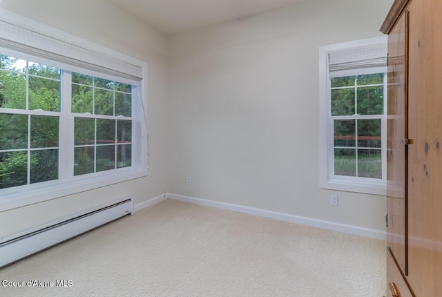 684 Chute Canyon Way, Bonners Ferry, ID 83805 - spare room with a baseboard radiator, baseboards, and light colored carpet