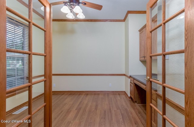 684 Chute Canyon Way, Bonners Ferry, ID 83805 - unfurnished room with ornamental molding, light wood finished floors, a ceiling fan, french doors, and baseboards