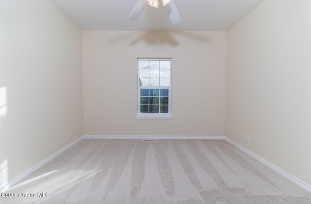 684 Chute Canyon Way, Bonners Ferry, ID 83805 - spare room featuring light carpet, ceiling fan, and baseboards