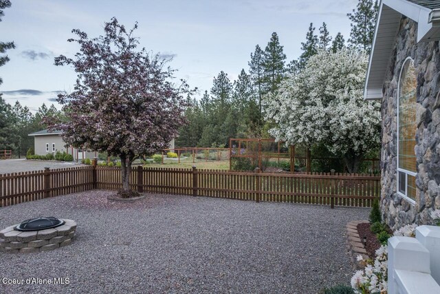 684 Chute Canyon Way, Bonners Ferry, ID 83805 - view of yard featuring an outdoor fire pit and fence
